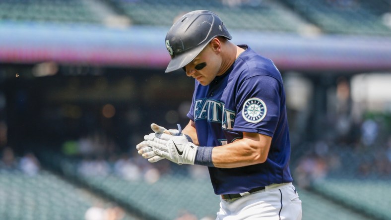 Aug 12, 2021; Seattle, Washington, USA; Seattle Mariners center fielder Jarred Kelenic (10) reacts after hitting a sacrifice fly against the Texas Rangers during the fourth inning at T-Mobile Park. Mandatory Credit: Joe Nicholson-USA TODAY Sports