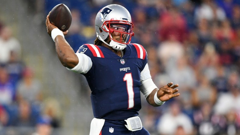 Aug 12, 2021; Foxborough, Massachusetts, USA; New England Patriots quarterback Cam Newton (1) throws the ball during the first half of a game against the Washington Football Team at Gillette Stadium. Mandatory Credit: Brian Fluharty-USA TODAY Sports