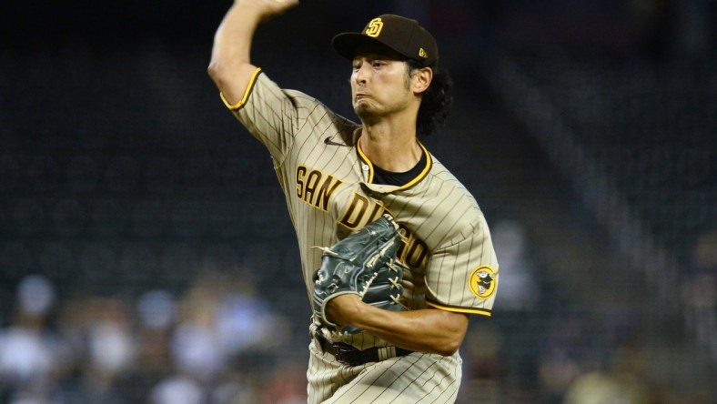 Aug 12, 2021; Phoenix, Arizona, USA; San Diego Padres pitcher Yu Darvish (11) throws against the Arizona Diamondbacks during the first inning at Chase Field. Mandatory Credit: Joe Camporeale-USA TODAY Sports