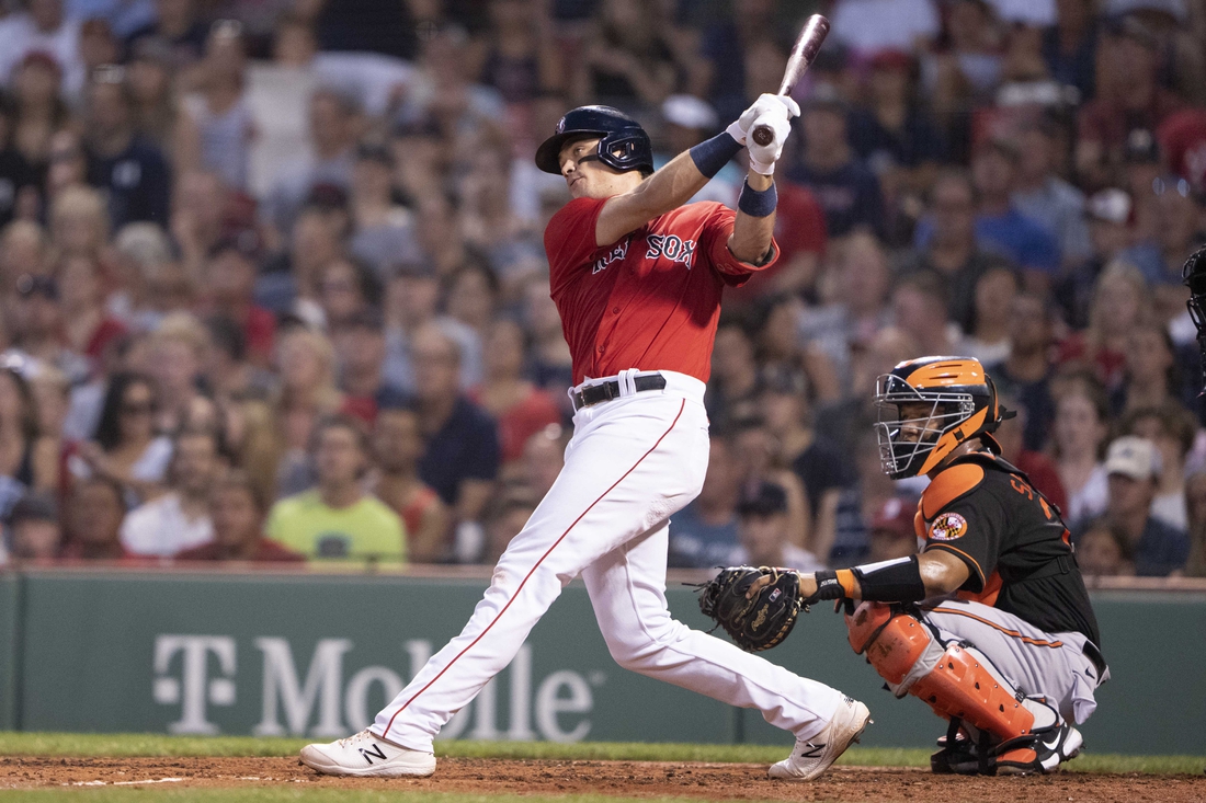 Aug 13, 2021; Boston, Massachusetts, USA; Boston Red Sox first baseman Bobby Dalbec (29) hits an RBI double during the second inning against the Baltimore Orioles at Fenway Park. Mandatory Credit: Gregory Fisher-USA TODAY Sports