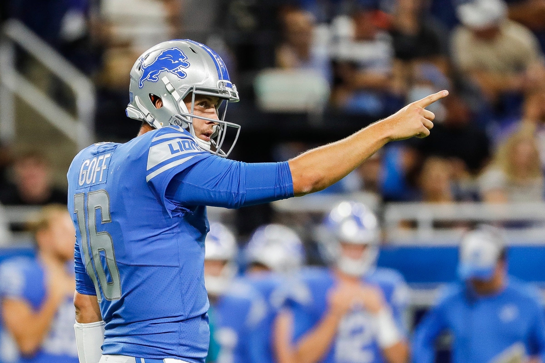 Lions quarterback Jared Goff (16) celebrates a first down against the Bills during the first half of the preseason game at Ford Field on Friday, Aug. 13, 2021.