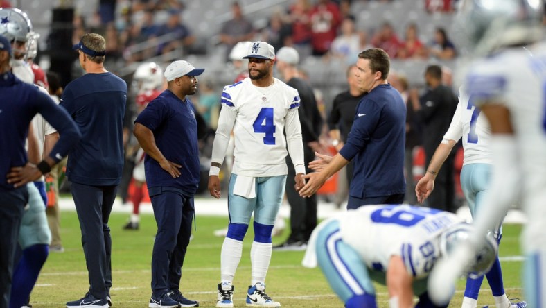 Aug 13, 2021; Glendale, Arizona, USA; Dallas Cowboys quarterback Dak Prescott (4) looks on prior to a preseason game against the Arizona Cardinals at State Farm Stadium. Mandatory Credit: Joe Camporeale-USA TODAY Sports