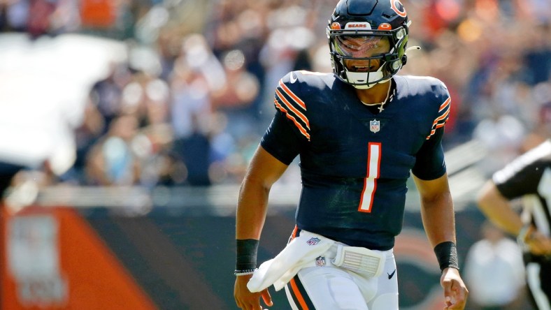 Aug 14, 2021; Chicago, Illinois, USA; Chicago Bears quarterback Justin Fields (1) celebrates his touchdown pass against the Miami Dolphins to tight end Jesse James (not pictured) during the second half at Soldier Field. Mandatory Credit: Jon Durr-USA TODAY Sports