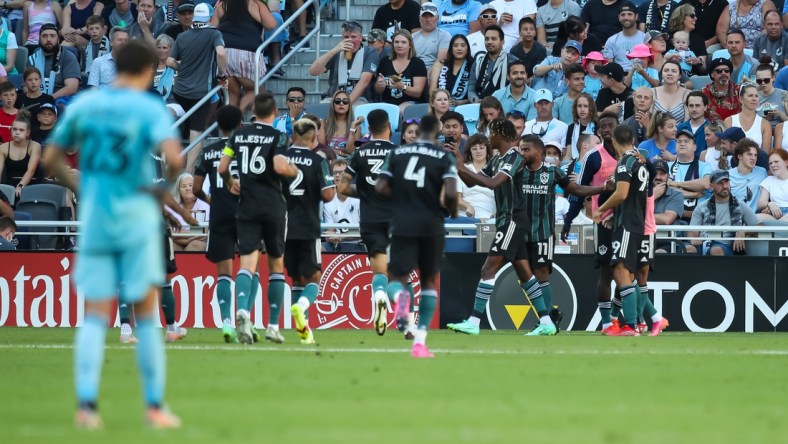 Aug 14, 2021; Saint Paul, MN, Saint Paul, MN, USA; Los Angeles Galaxy forward Kevin Cabral (9) celebrates with teammates after scoring a goal against Minnesota United in the first half at Allianz Field. Mandatory Credit: David Berding-USA TODAY Sports