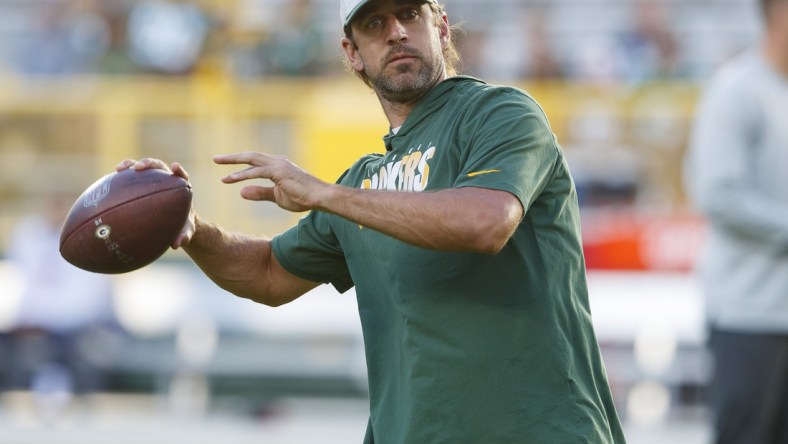 Aug 14, 2021; Green Bay, Wisconsin, USA;  Green Bay Packers quarterback Aaron Rodgers throws a pass during warmups prior to a game against the  Houston Texans at Lambeau Field. Mandatory Credit: Jeff Hanisch-USA TODAY Sports