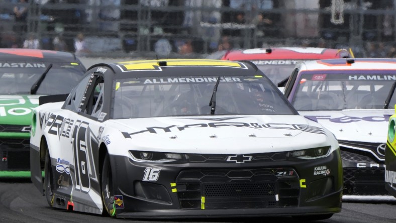 Aug 15, 2021; Speedway, Indiana, USA; NASCAR Cup Series driver AJ Allmendinger (16) during the Verizon 200 at the Brickyard at Indianapolis Motor Speedway Road Course. Mandatory Credit: Mike Dinovo-USA TODAY Sports