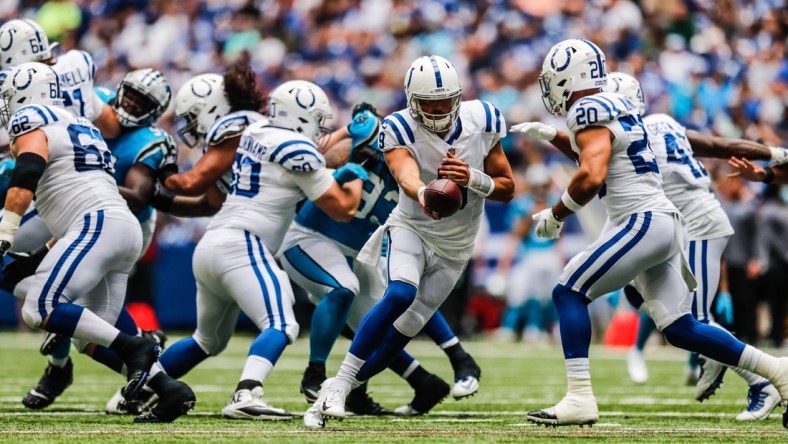 Indianapolis Colts quarterback Jacob Eason (9) hands the ball off to Indianapolis Colts running back Jordan Wilkins (20) on Sunday, Aug. 15, 2021, during a pre-season game between the Indianapolis Colts and the Carolina Panthers at Lucas Oil Stadium in Indianapolis.

Finals 17