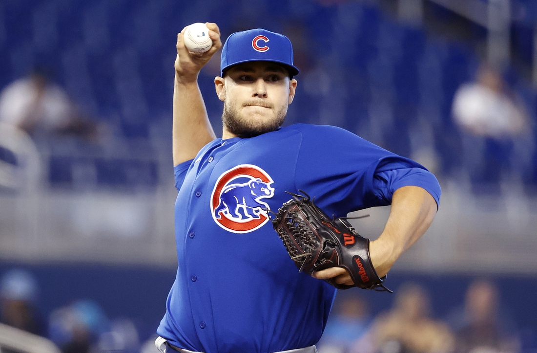 Aug 15, 2021; Miami, Florida, USA;  Chicago Cubs relief pitcher Ryan Meisinger (64) throws to first base during the eighth inning against the Miami Marlins at loanDepot Park. Mandatory Credit: Rhona Wise-USA TODAY Sports