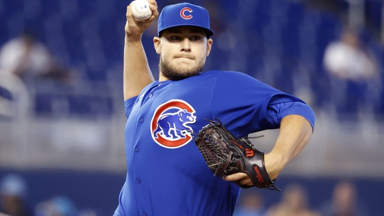 Aug 15, 2021; Miami, Florida, USA;  Chicago Cubs relief pitcher Ryan Meisinger (64) throws to first base during the eighth inning against the Miami Marlins at loanDepot Park. Mandatory Credit: Rhona Wise-USA TODAY Sports