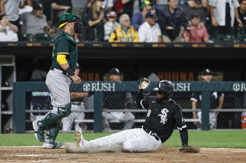 Aug 16, 2021; Chicago, Illinois, USA; Chicago White Sox center fielder Luis Robert (88) scores against the Oakland Athletics during the fourth inning at Guaranteed Rate Field. Mandatory Credit: Kamil Krzaczynski-USA TODAY Sports