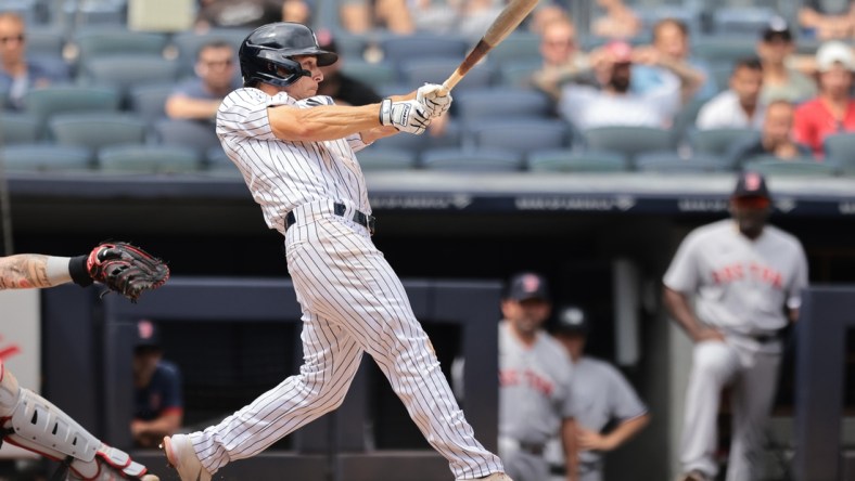 Aug 17, 2021; Bronx, New York, USA; New York Yankees shortstop Andrew Velazquez (71) hits a two RBI single against the Boston Red Sox during the second inning at Yankee Stadium. Mandatory Credit: Vincent Carchietta-USA TODAY Sports