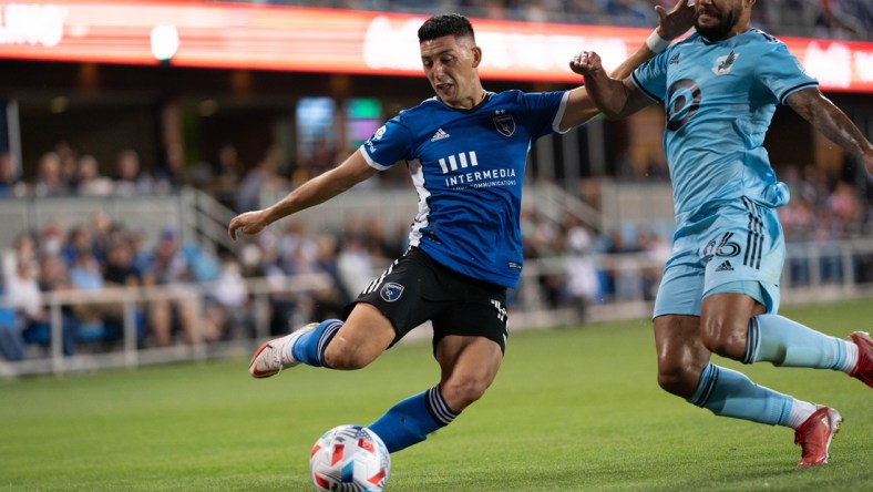 Aug 17, 2021; San Jose, California, USA;  Minnesota United defender D.J. Taylor (26) attempts to defend against San Jose Earthquakes forward Cristian Espinoza (10) during the first half at PayPal Park. Mandatory Credit: Stan Szeto-USA TODAY Sports