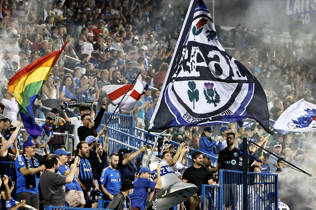 Aug 14, 2021; Montreal, Quebec, CAN; CF Montreal fans celebrate during the second half at Stade Saputo. Mandatory Credit: Jean-Yves Ahern-USA TODAY Sports