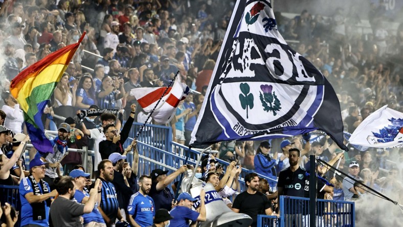 Aug 14, 2021; Montreal, Quebec, CAN; CF Montreal fans celebrate during the second half at Stade Saputo. Mandatory Credit: Jean-Yves Ahern-USA TODAY Sports