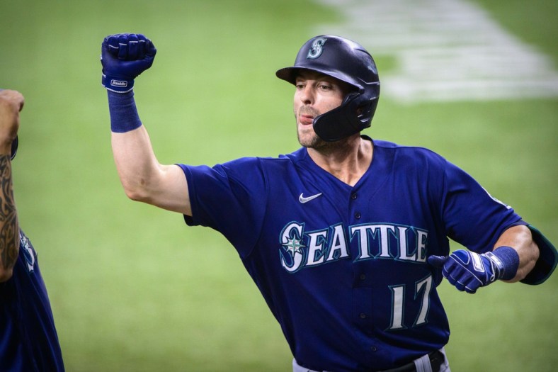 Aug 19, 2021; Arlington, Texas, USA; Seattle Mariners designated hitter Mitch Haniger (17) celebrates hitting a three run home run against the Texas Rangers during the second inning at Globe Life Field. Mandatory Credit: Jerome Miron-USA TODAY Sports