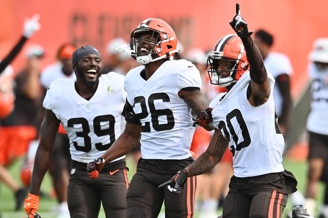 Aug 19, 2021; Berea, OH, USA; Cleveland Browns cornerback Greg Newsome II (20) celebrates with safety Richard LeCounte III (39) and cornerback Greedy Williams (26) after intercepting a pass during a joint practice with the New York Giants at CrossCountry Mortgage Campus. Mandatory Credit: Ken Blaze-USA TODAY Sports