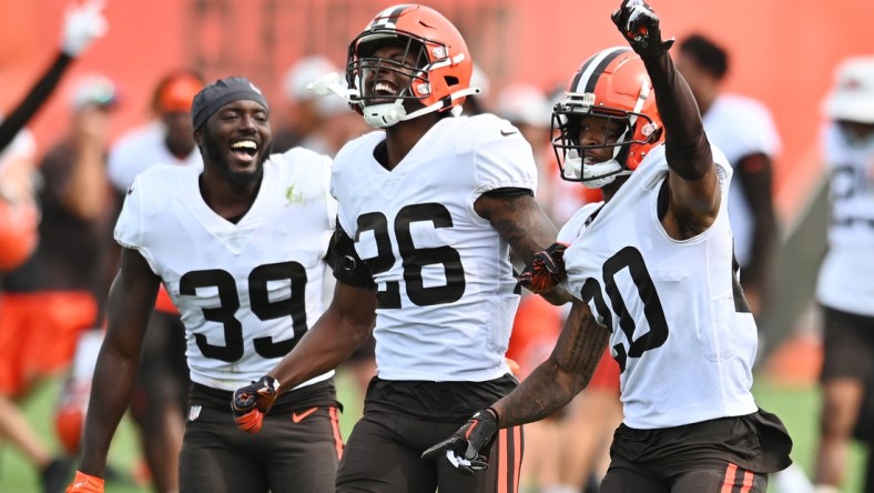 Aug 19, 2021; Berea, OH, USA; Cleveland Browns cornerback Greg Newsome II (20) celebrates with safety Richard LeCounte III (39) and cornerback Greedy Williams (26) after intercepting a pass during a joint practice with the New York Giants at CrossCountry Mortgage Campus. Mandatory Credit: Ken Blaze-USA TODAY Sports