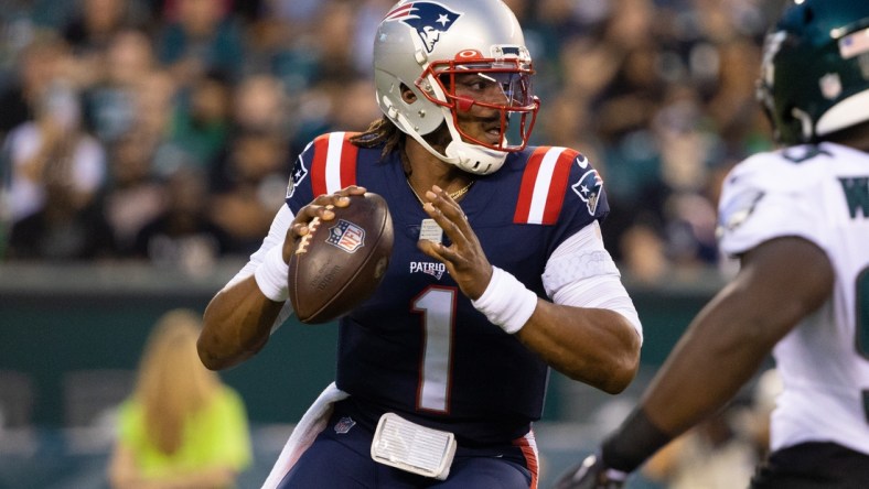 Aug 19, 2021; Philadelphia, Pennsylvania, USA; New England Patriots quarterback Cam Newton (1) drops back to pass against the Philadelphia Eagles during the first quarter at Lincoln Financial Field. Mandatory Credit: Bill Streicher-USA TODAY Sports