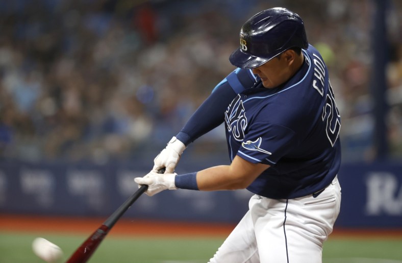 Aug 20, 2021; St. Petersburg, Florida, USA; Tampa Bay Rays first baseman Ji-Man Choi (26) hits a home run during the second inning against the Chicago White Sox at Tropicana Field. Mandatory Credit: Kim Klement-USA TODAY Sports