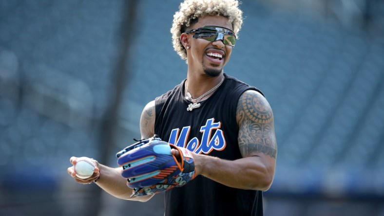 Aug 10, 2021; New York City, New York, USA; New York Mets injured shortstop Francisco Lindor works out on the field before a game against the Washington Nationals at Citi Field. Mandatory Credit: Brad Penner-USA TODAY Sports