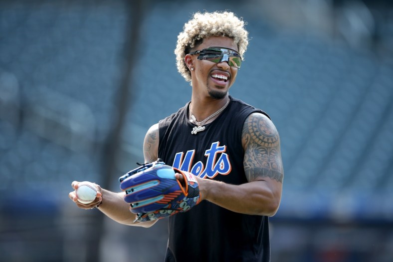 Aug 10, 2021; New York City, New York, USA; New York Mets injured shortstop Francisco Lindor works out on the field before a game against the Washington Nationals at Citi Field. Mandatory Credit: Brad Penner-USA TODAY Sports