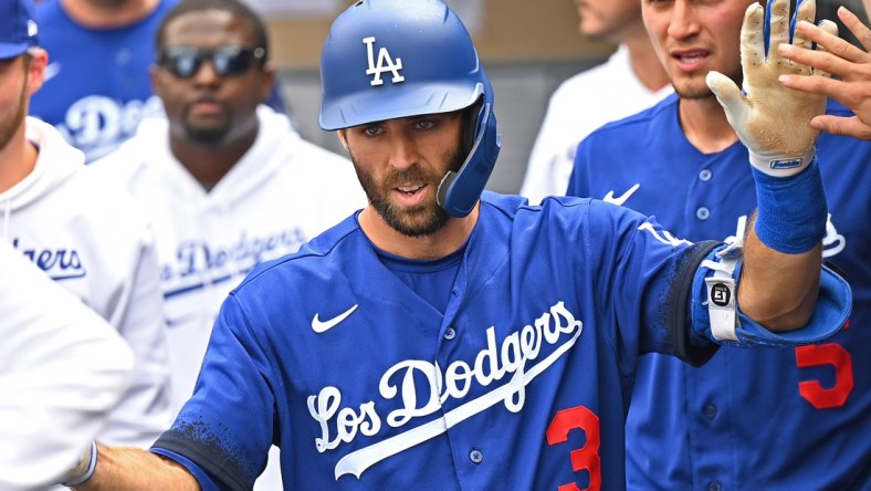 Aug 21, 2021; Los Angeles, California, USA;  Los Angeles Dodgers left fielder Chris Taylor (3) is greeted in the dugout after hitting a solo home run in the fourth inning of the game against the New York Mets at Dodger Stadium. Mandatory Credit: Jayne Kamin-Oncea-USA TODAY Sports