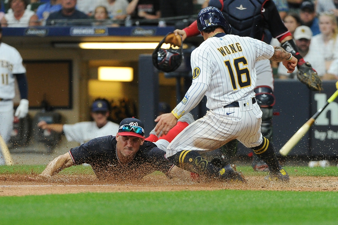 MILWAUKEE, WI - AUGUST 22: Milwaukee Brewers second baseman Kolten Wong  (16) runs the bases during an MLB game against the Washington Nationals on  August 22, 2021 at American Family Field in