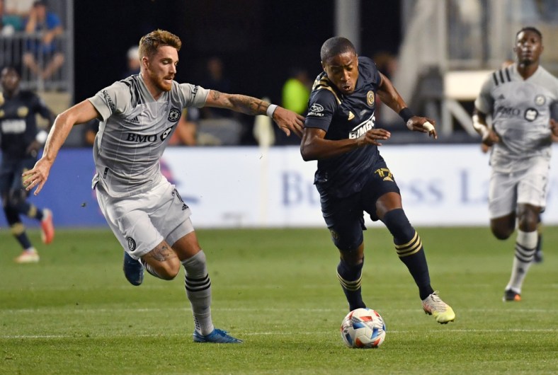 Aug 21, 2021; Chester, Pennsylvania, USA; CF Montreal defender Joel Waterman (16) and Philadelphia Union forward Sergio Santos (17) battle for the ball during the first half at Talen Energy Stadium. Mandatory Credit: Eric Hartline-USA TODAY Sports