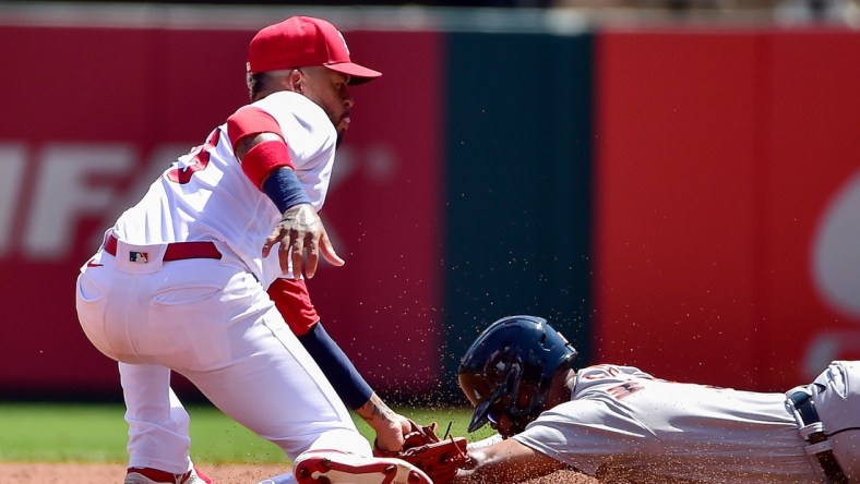 Aug 25, 2021; St. Louis, Missouri, USA;  St. Louis Cardinals second baseman Edmundo Sosa (63) tags out Detroit Tigers second baseman Willi Castro (9) as he attempt to steal second during the second inning at Busch Stadium. Mandatory Credit: Jeff Curry-USA TODAY Sports