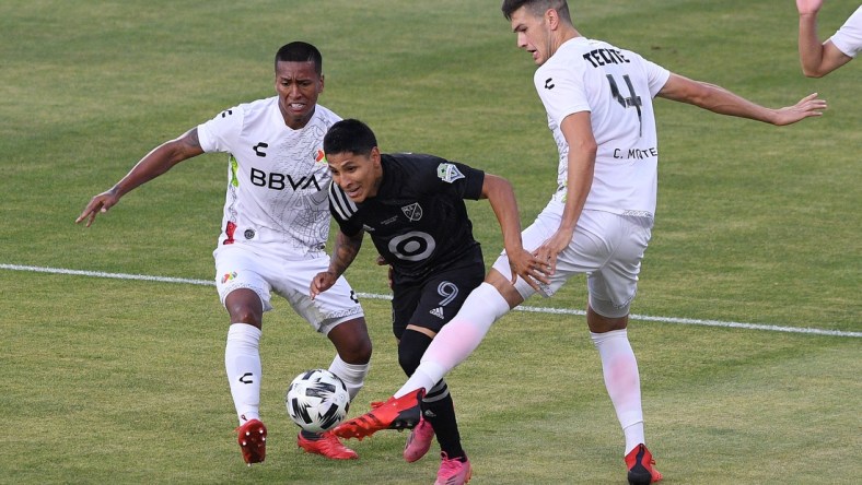 Aug 25, 2021; Los Angeles, CA, USA; Liga MX All-Stars defender Cesar Montes (4) defends against MLS All-Stars forward Raul Ruidiaz (9) in the first half during the 2021 MLS All-Star Game at Banc of California Stadium. Mandatory Credit: Orlando Ramirez-USA TODAY Sports