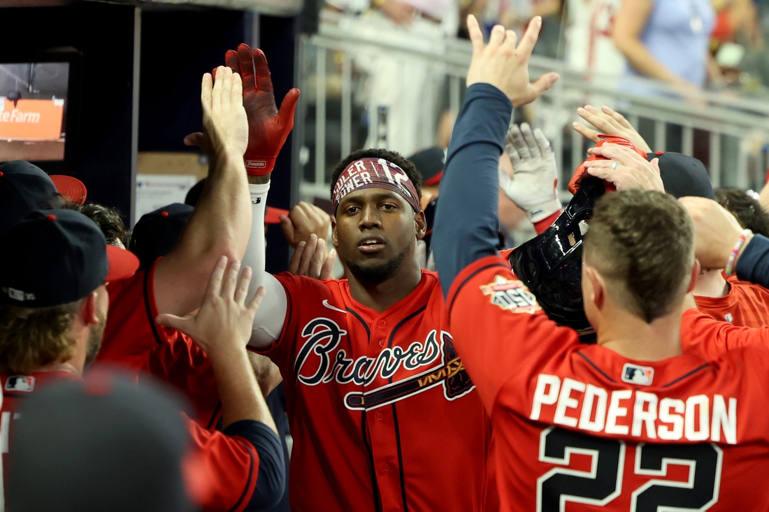 Aug 27, 2021; Atlanta, Georgia, USA; Atlanta Braves outfielder Jorge Soler (12) celebrates his three-run home run during the seventh inning against the San Francisco Giants at Truist Park. Mandatory Credit: Jason Getz-USA TODAY Sports