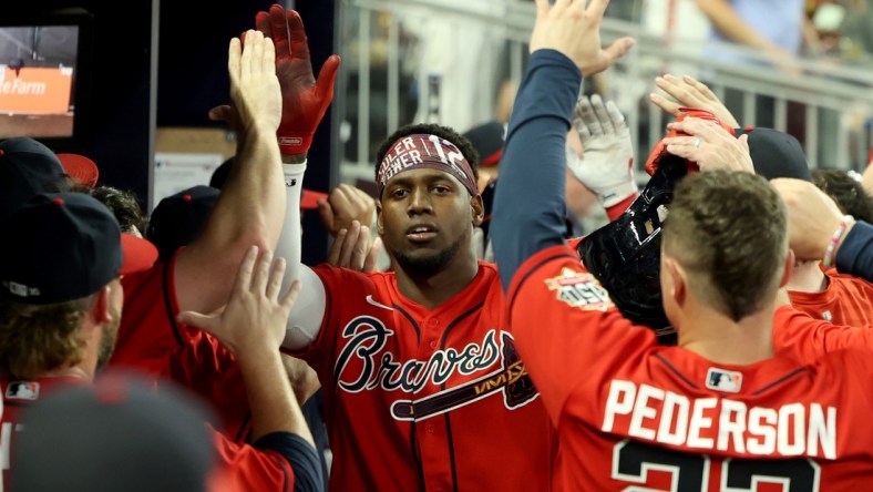 Aug 27, 2021; Atlanta, Georgia, USA; Atlanta Braves outfielder Jorge Soler (12) celebrates his three-run home run during the seventh inning against the San Francisco Giants at Truist Park. Mandatory Credit: Jason Getz-USA TODAY Sports