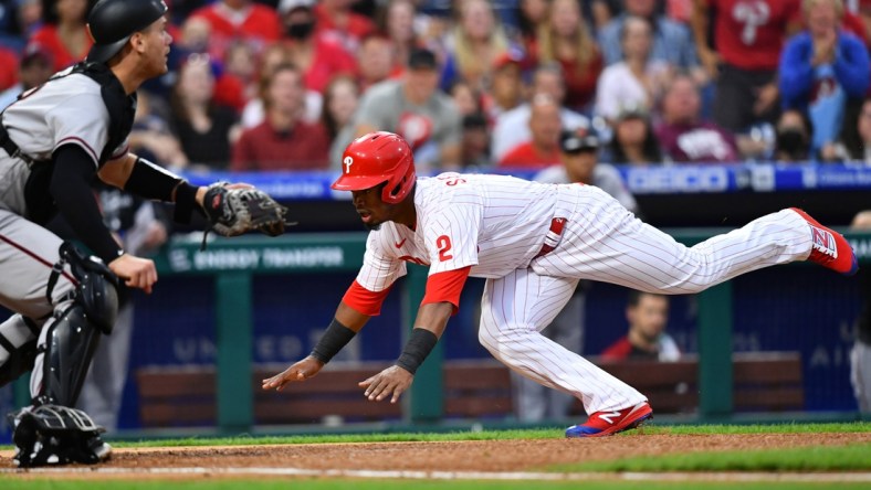 Aug 28, 2021; Philadelphia, Pennsylvania, USA; Philadelphia Phillies infielder Jean Segura (2) dives home to score in the first inning against the Arizona Diamondbacks at Citizens Bank Park. Mandatory Credit: Kyle Ross-USA TODAY Sports