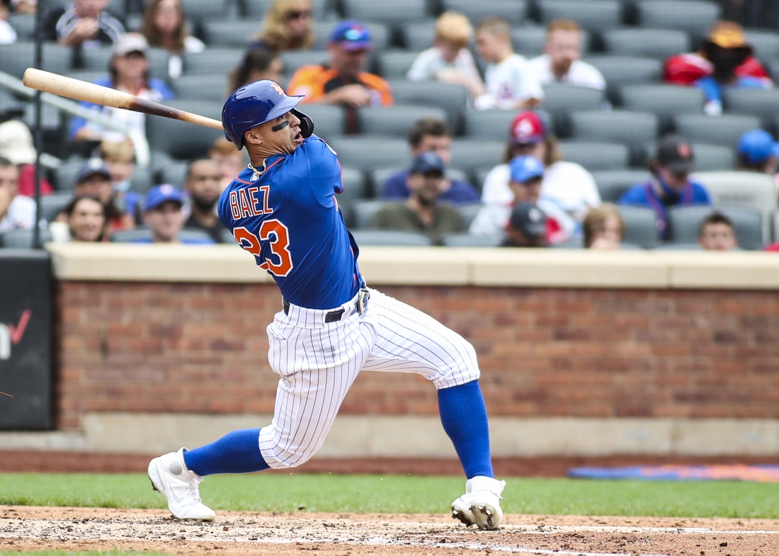 Aug 29, 2021; New York City, New York, USA;  New York Mets second baseman Javier Baez (23) hits a two run home run in the fourth inning against the Washington Nationals at Citi Field. Mandatory Credit: Wendell Cruz-USA TODAY Sports