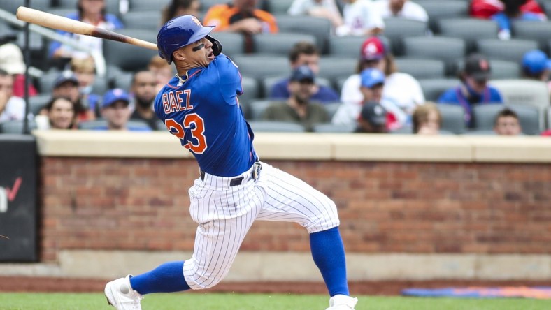 Aug 29, 2021; New York City, New York, USA;  New York Mets second baseman Javier Baez (23) hits a two run home run in the fourth inning against the Washington Nationals at Citi Field. Mandatory Credit: Wendell Cruz-USA TODAY Sports