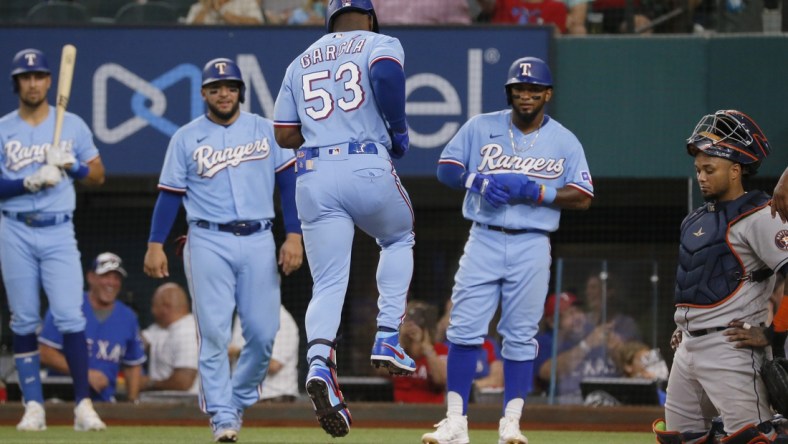 Aug 29, 2021; Arlington, Texas, USA; Texas Rangers right fielder Adolis Garcia (53) reaches home after hitting a grand slam against the Houston Astros during the fifth inning at Globe Life Field. Mandatory Credit: Raymond Carlin III-USA TODAY Sports