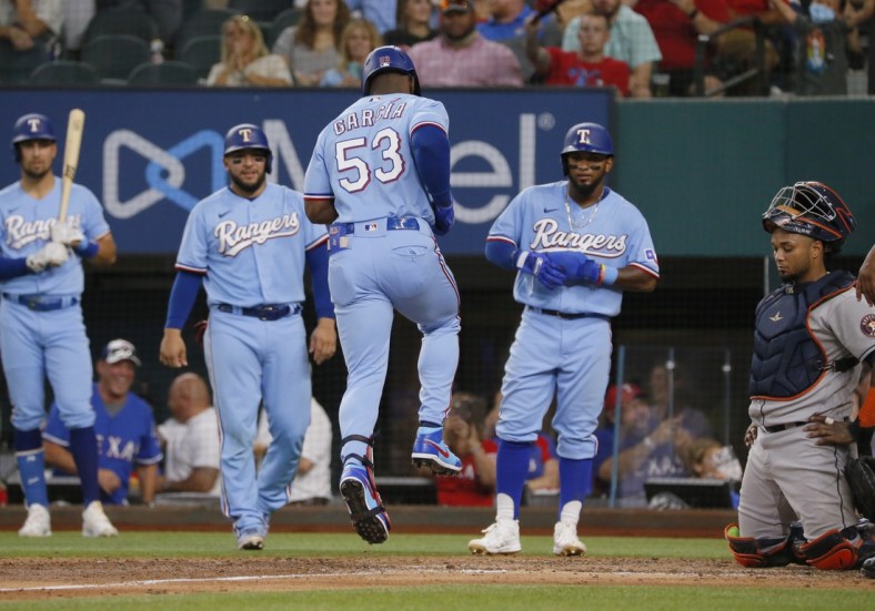Aug 29, 2021; Arlington, Texas, USA; Texas Rangers right fielder Adolis Garcia (53) reaches home after hitting a grand slam against the Houston Astros during the fifth inning at Globe Life Field. Mandatory Credit: Raymond Carlin III-USA TODAY Sports