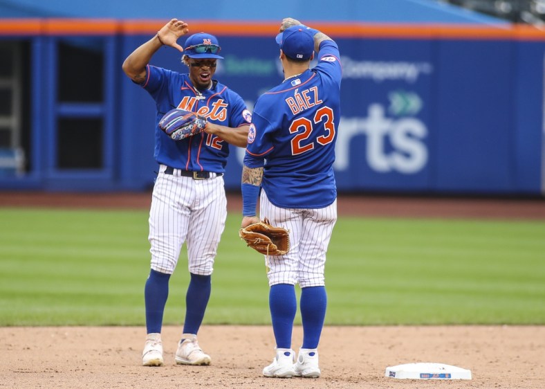 Aug 29, 2021; New York City, New York, USA; New York Mets shortstop Francisco Lindor (12) and second baseman Javier Baez (23) celebrate after defeating the Washington Nationals 9-4 at Citi Field. Mandatory Credit: Wendell Cruz-USA TODAY Sports