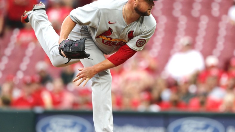 Aug 30, 2021; Cincinnati, Ohio, USA; St. Louis Cardinals starting pitcher Jon Lester (31) releases a pitch against the Cincinnati Reds during the first inning at Great American Ball Park. Mandatory Credit: David Kohl-USA TODAY Sports