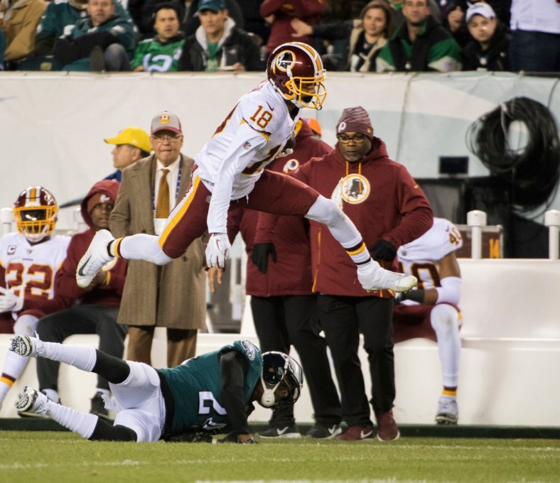 Redskins' Josh Doctson (18) leaps while carrying the ball against the Eagles Monday, Dec. 3, 2018 in Philadelphia. The Eagles won 28-13.

Jl Birds 12318 04