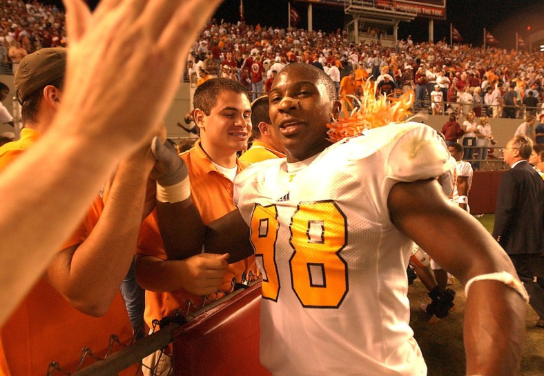 Tennessee's (98) Parys Haralson heads for the fans at the end of the fifth overtime and their win  over Alabama.        10/25/2003

Utalabama6 Mp227