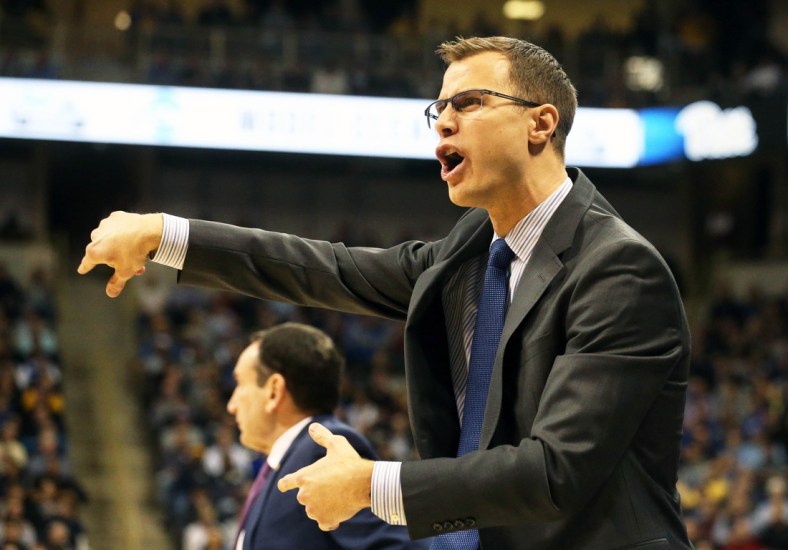 Jan 22, 2019; Pittsburgh, PA, USA;  Duke Blue Devils associate head coach Jon Scheyer reacts on the bench against the Pittsburgh Panthers during the first half at the Petersen Events Center. Duke won 79-64. Mandatory Credit: Charles LeClaire-USA TODAY Sports