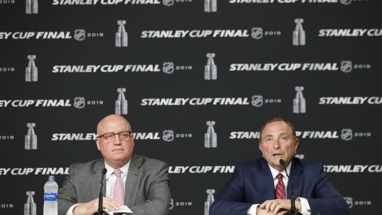 May 27, 2019; Boston, MA, USA; NHL commissioner Gary Bettman (right) and deputy commissioner Bill Daly (left) at a press conference before game one of the 2019 Stanley Cup Final between the Boston Bruins and the St. Louis Blues at TD Garden. Mandatory Credit: Winslow Townson-USA TODAY Sports