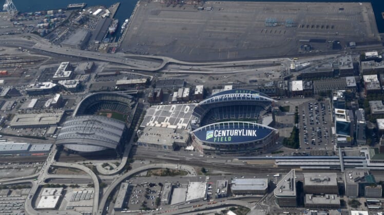 Aug 29, 2019; Seattle, WA, USA; General overall aerial view of T-Mobile Park (left) and CenturyLink Field. The retractable roof T-Mobile Park, opened in 1999 and formerly known as Safeco Field, is the home of the Seattle Mariners of the MLB. CenturyLink Field was opened in 2002 and was named Seahawks Stadium (2002-2004) and Qwest Field (2004-11). It is the home of the Seattle Seahawks of the NFL and Seattle Sounders of the MLS.Mandatory Credit: Kirby Lee-USA TODAY Sports