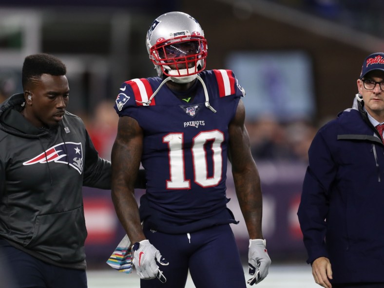 Oct 10, 2019; Foxborough, MA, USA; New England Patriots wide receiver Josh Gordon (10) is helped off of the field during the first half against the New York Giants at Gillette Stadium. Mandatory Credit: Paul Rutherford-USA TODAY Sports
