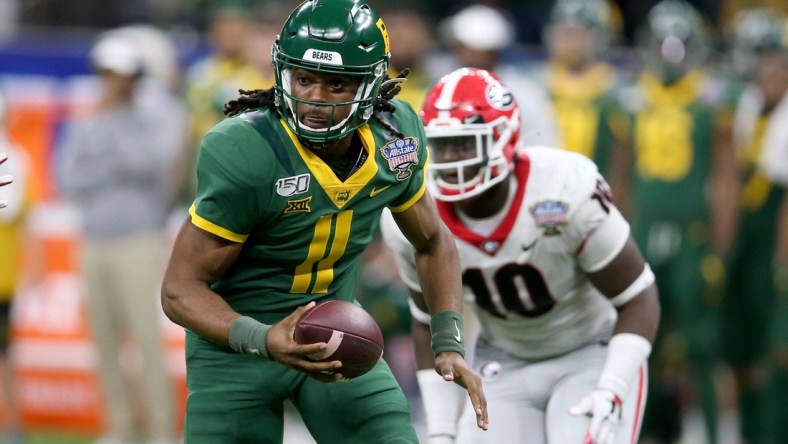 Jan 1, 2020; New Orleans, Louisiana, USA; Baylor Bears quarterback Gerry Bohanon (11) scrambles from pressure by the Georgia Bulldogs in the second half of the Sugar Bowl at the Mercedes-Benz Superdome. Mandatory Credit: Chuck Cook-USA TODAY Sports