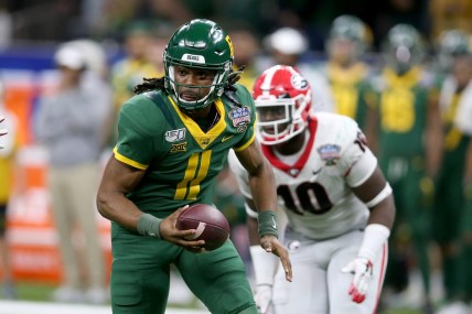 Jan 1, 2020; New Orleans, Louisiana, USA; Baylor Bears quarterback Gerry Bohanon (11) scrambles from pressure by the Georgia Bulldogs in the second half of the Sugar Bowl at the Mercedes-Benz Superdome. Mandatory Credit: Chuck Cook-USA TODAY Sports