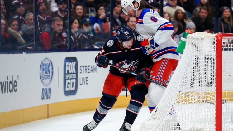 Feb 14, 2020; Columbus, Ohio, USA; Columbus Blue Jackets center Nathan Gerbe (24) skates against New York Rangers defenseman Jacob Trouba (8) in the second period at Nationwide Arena. Mandatory Credit: Aaron Doster-USA TODAY Sports