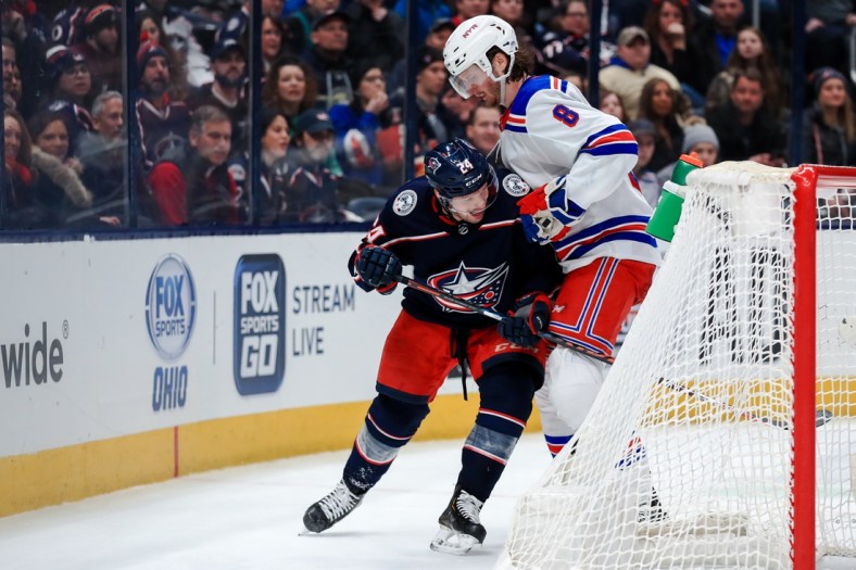 Feb 14, 2020; Columbus, Ohio, USA; Columbus Blue Jackets center Nathan Gerbe (24) skates against New York Rangers defenseman Jacob Trouba (8) in the second period at Nationwide Arena. Mandatory Credit: Aaron Doster-USA TODAY Sports