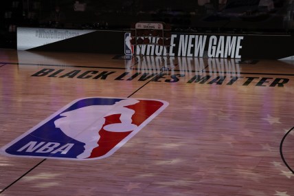 July 30, 2020; Lake Buena Vista, USA;  A general view the court with Black Lives Matter written above the NBA logo is seen at center court prior to the game between the LA Clippers and the Los Angeles Lakers at The Arena at ESPN Wide World Of Sports Complex. Mandatory Credit: Mike Ehrmann/Pool Photo via USA TODAY Sports